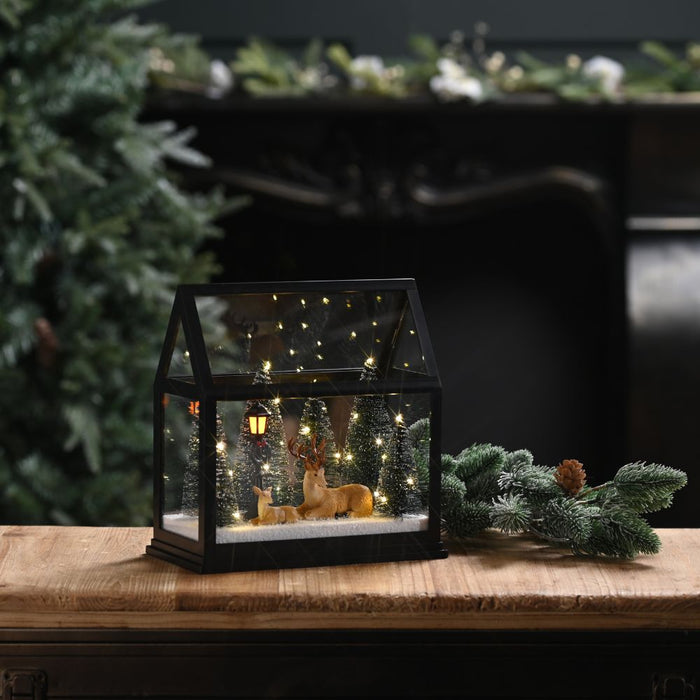 Festive Lit Glass House with Reindeer and Trees
