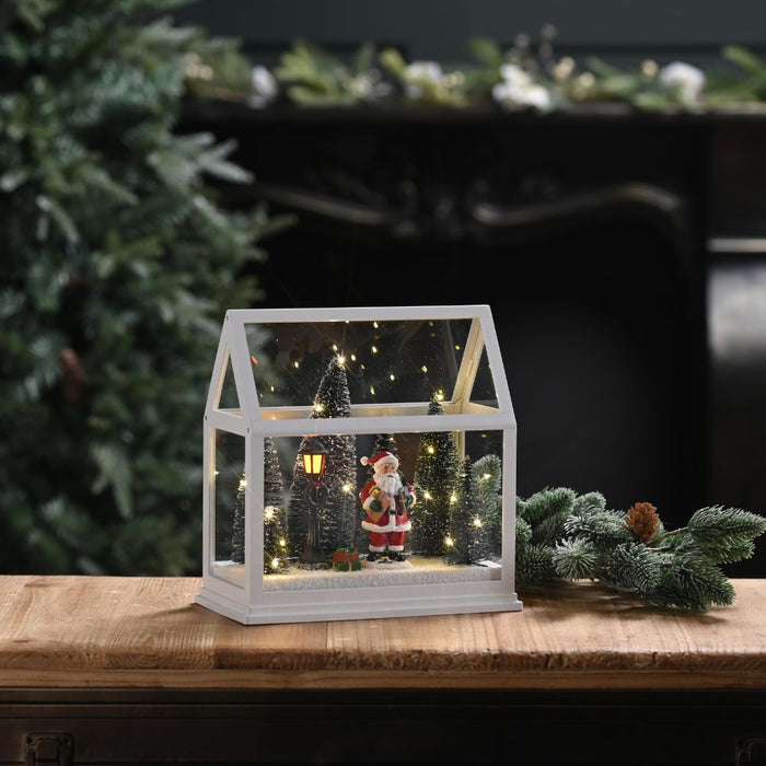 Festive Lit Glass House with Santa and Trees