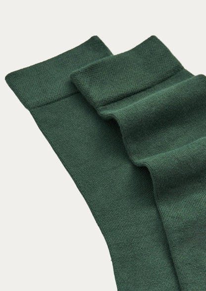 A pair of forest green bamboo blend calf-length crew socks.