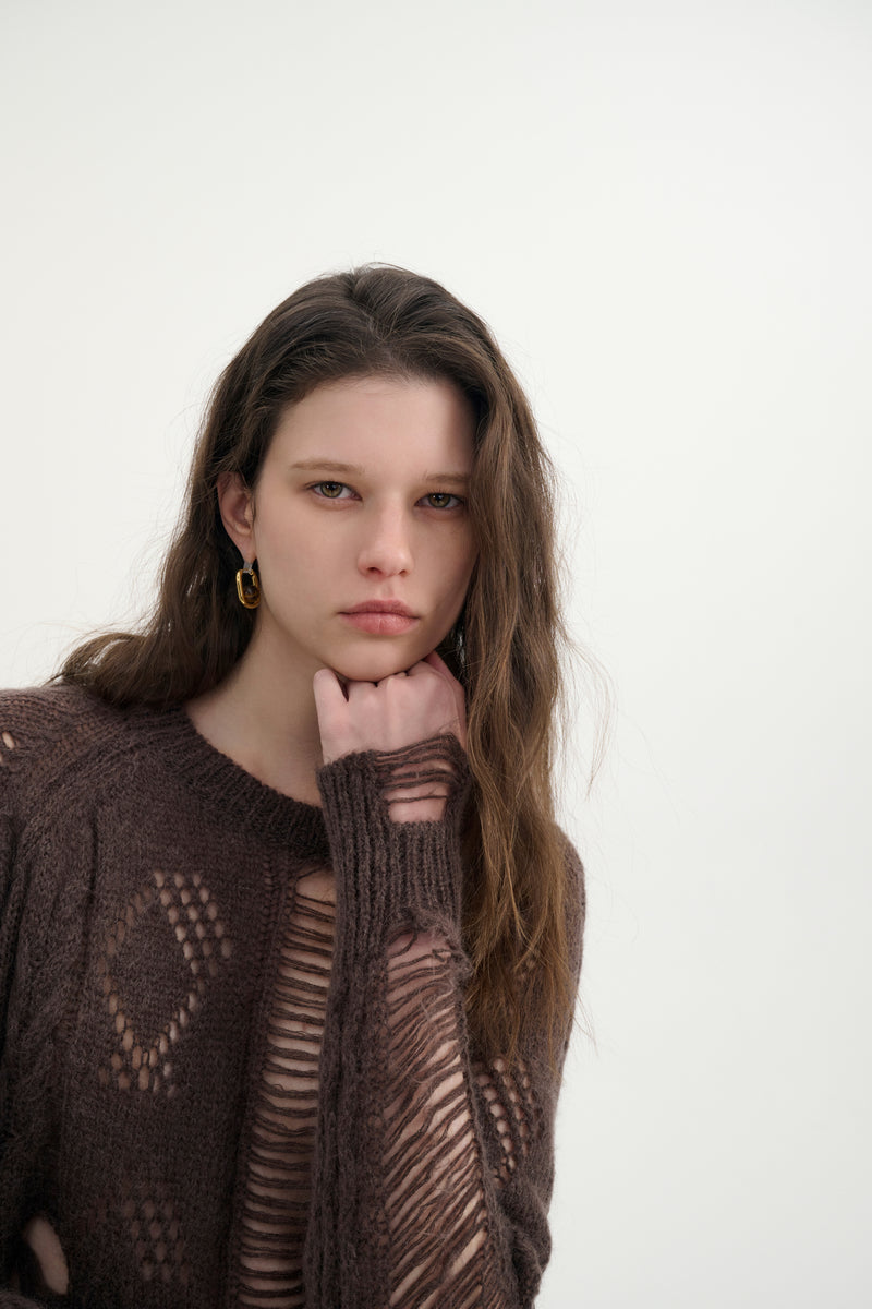Distressed relaxed sweater