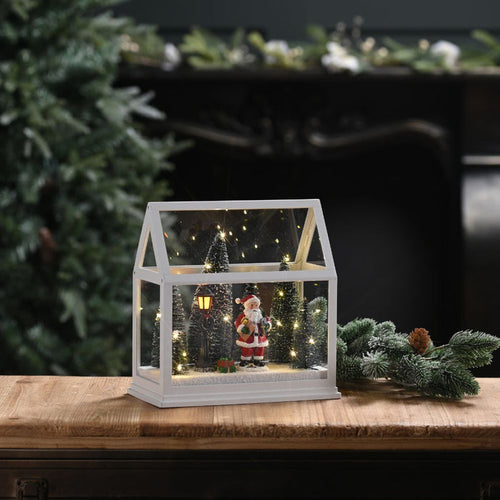 Festive Lit Glass House with Santa and Trees