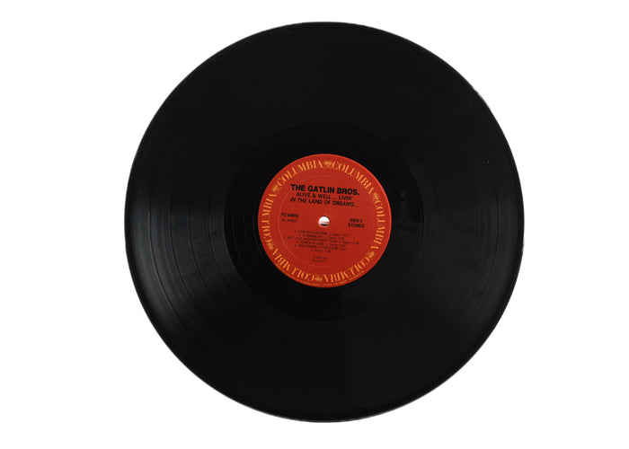 Larry Gatlin And The Gatlin Bros.*    -   Alive & Well...Livin' In The Land Of Dreams